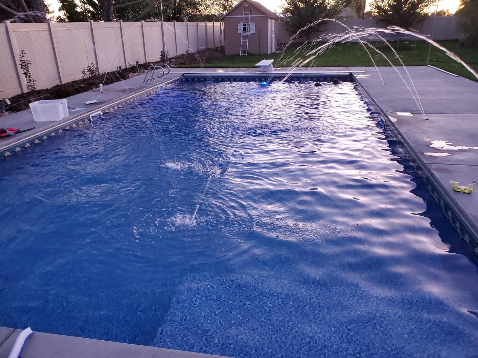 Custom pool with arcing water features